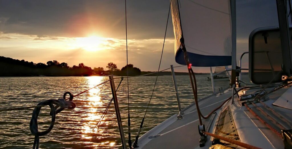 yacht sailing sunset